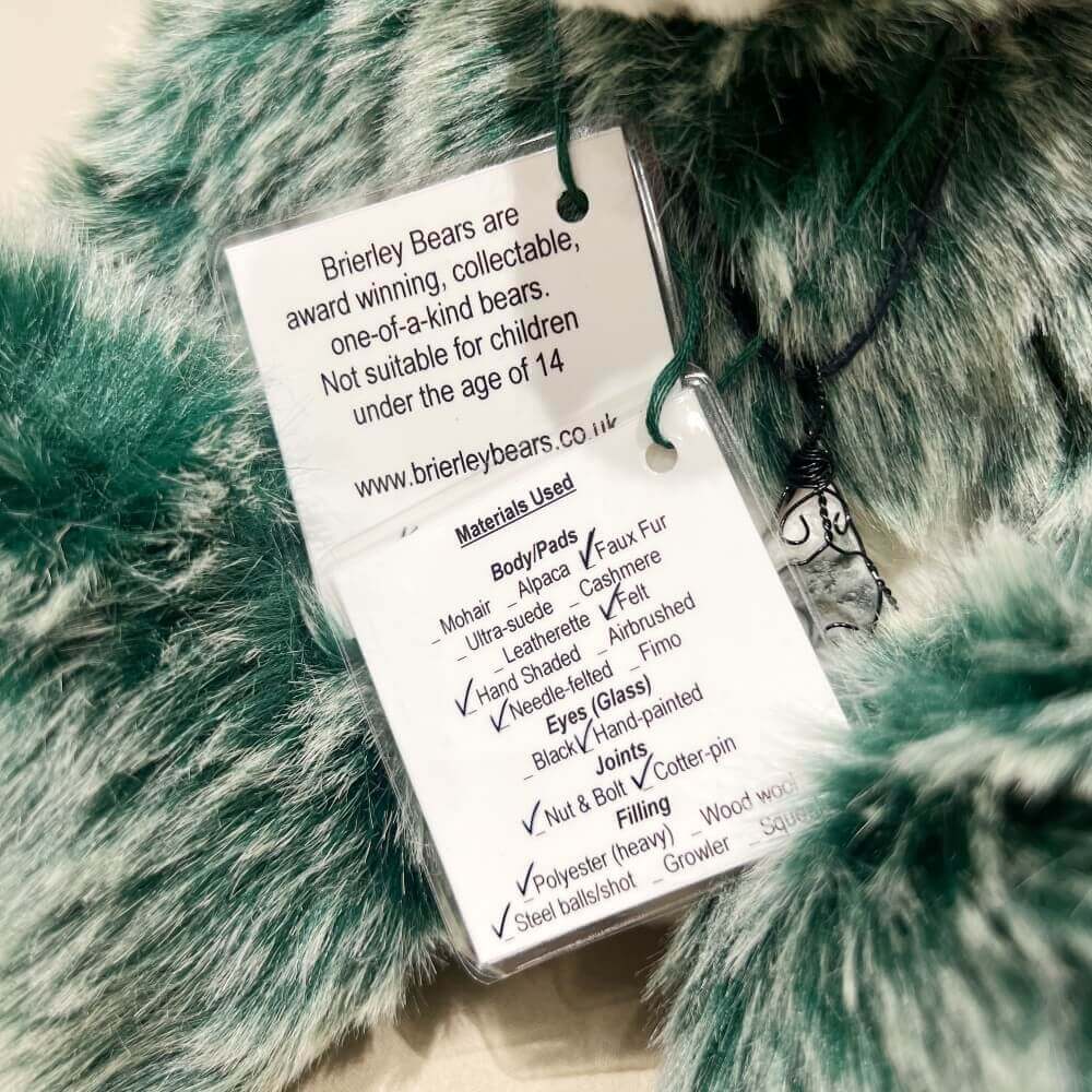 Back of individually designed identity hang tags for Feng by Brierley Bears.