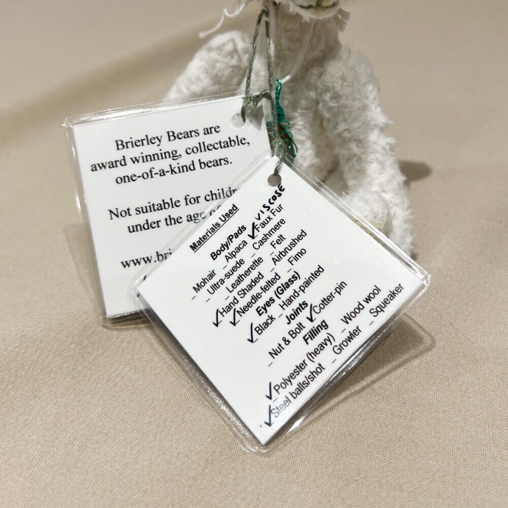 Back of individually designed identity hang tags for Pistachio by Brierley Bears.