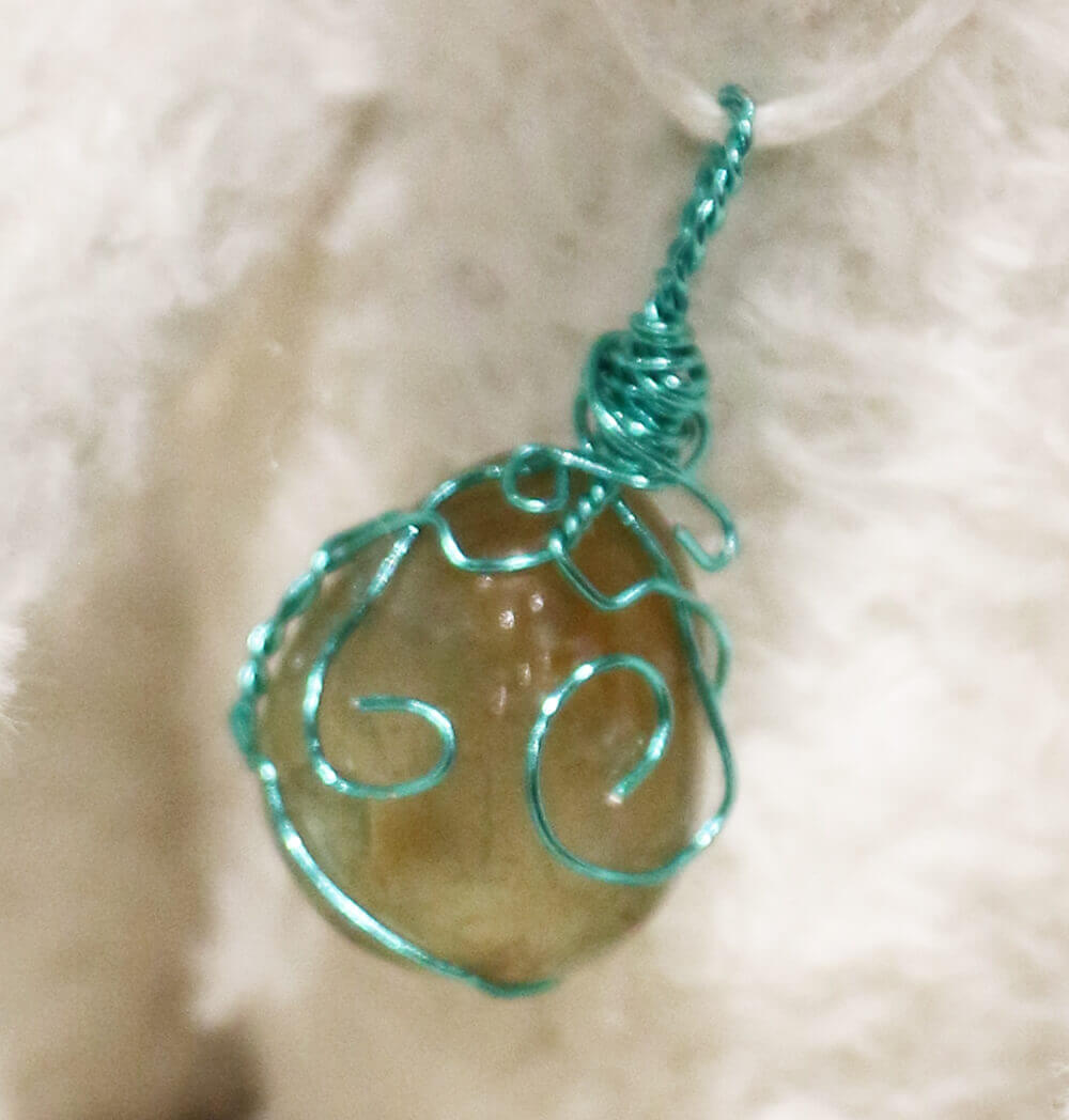 Pistachio - handmade by Brierley Bears. Crystal wire wrapped pendant.